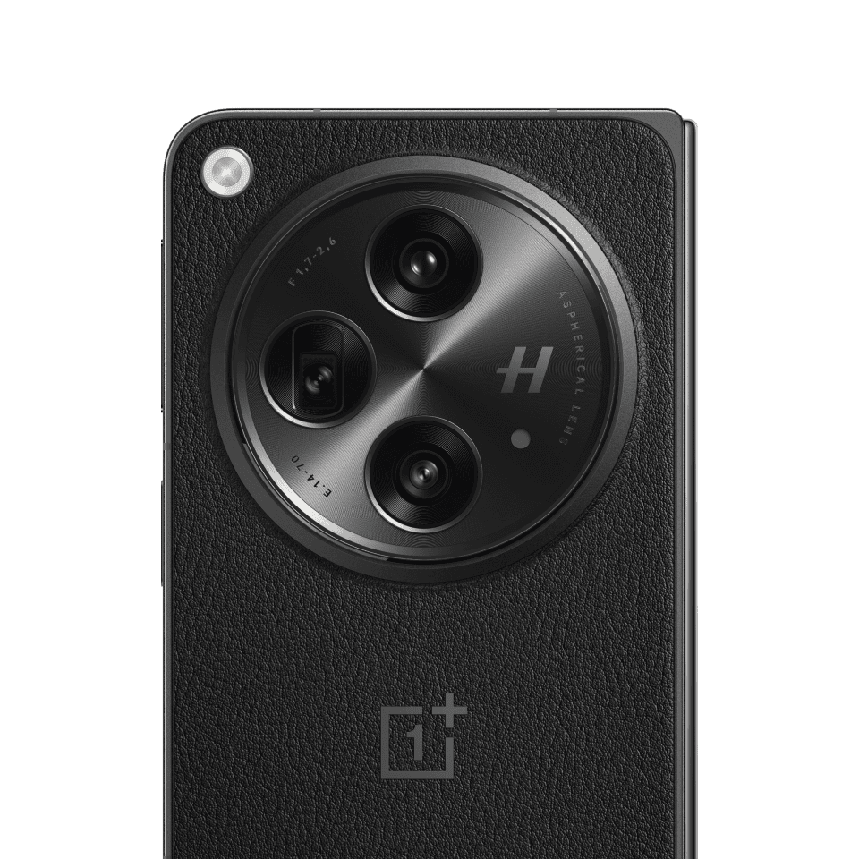 Black and circular camera module on a black smartphone body.