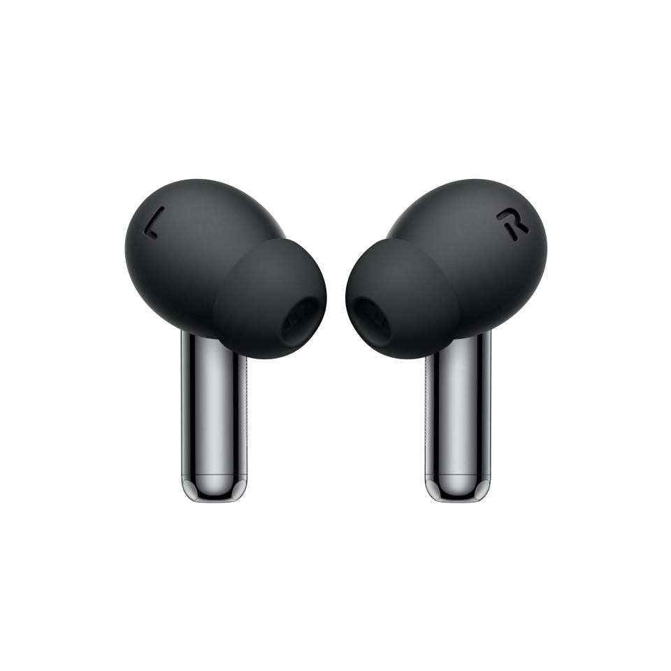 A pair of sleek, dark wireless earbuds on a green background.