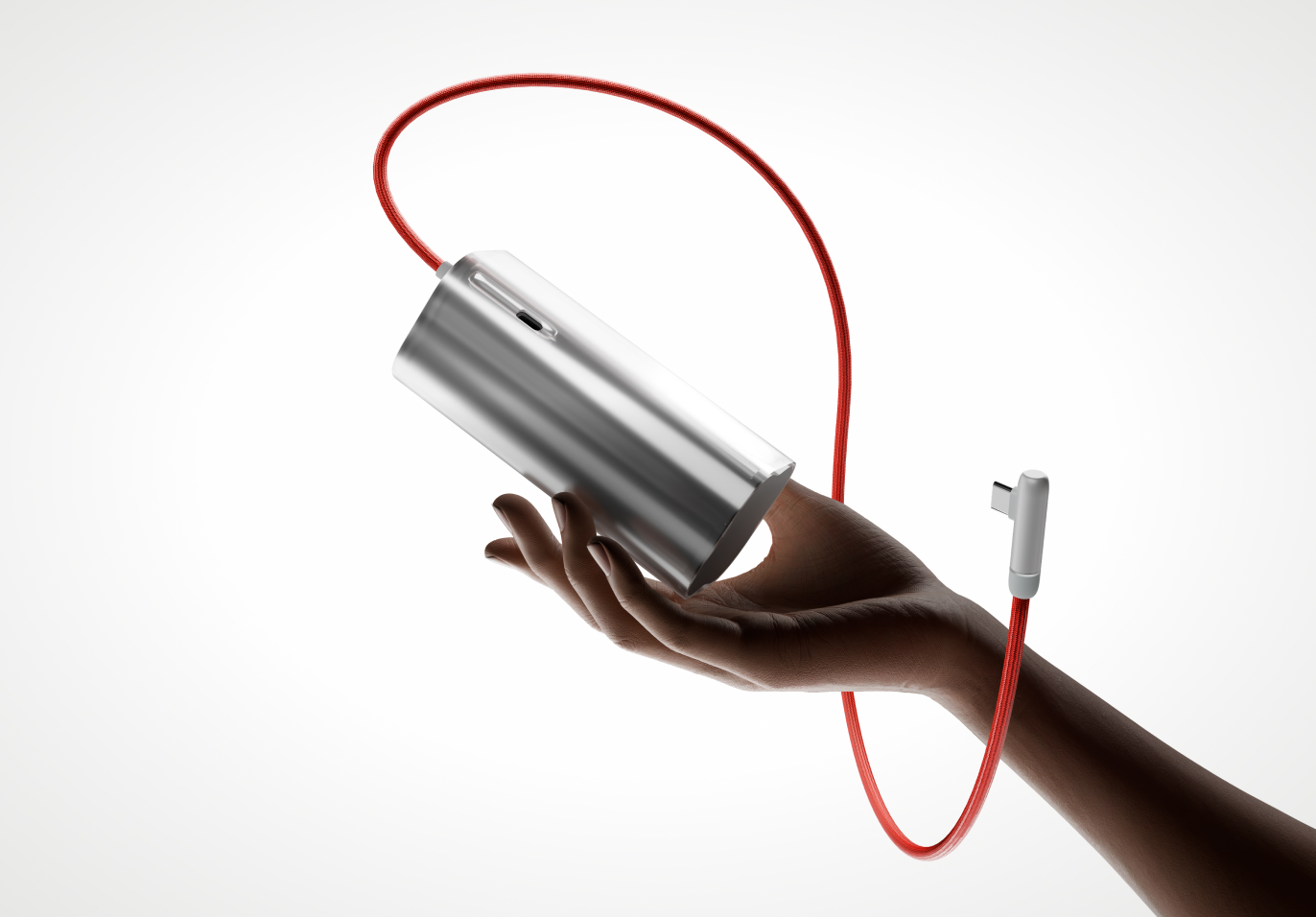 Sleek silver metallic power bank in a hand, connected by a red cord.