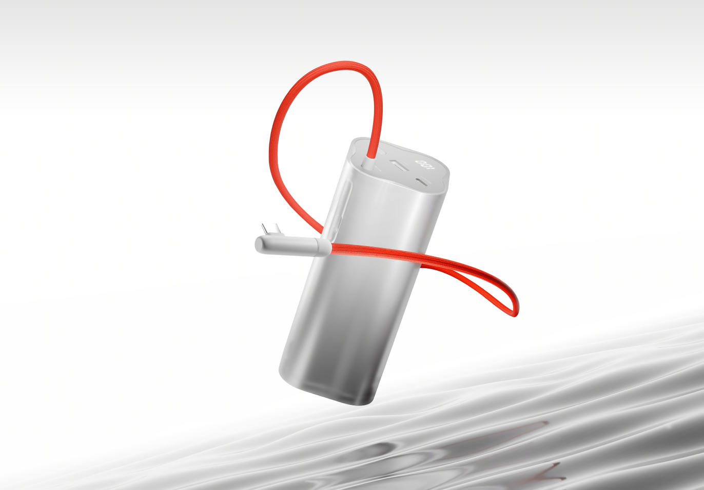 Cylindrical silver power bank with red charging cable.