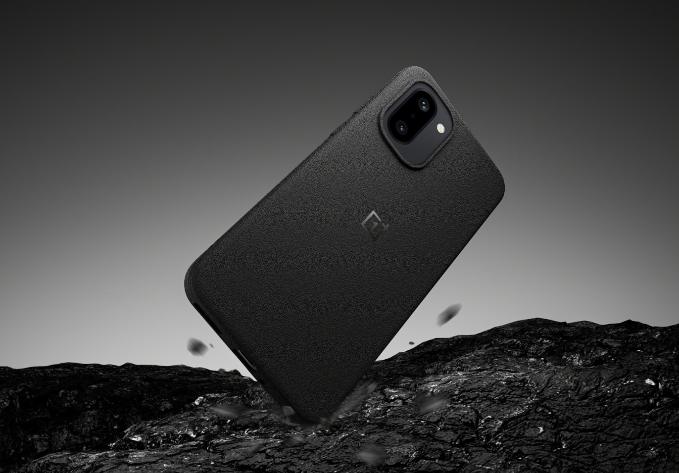 Black smartphone with camera on rocky surface